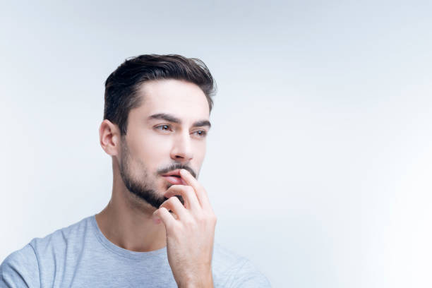 istock Concentrated young specialist sitting at work and thinking 874537142