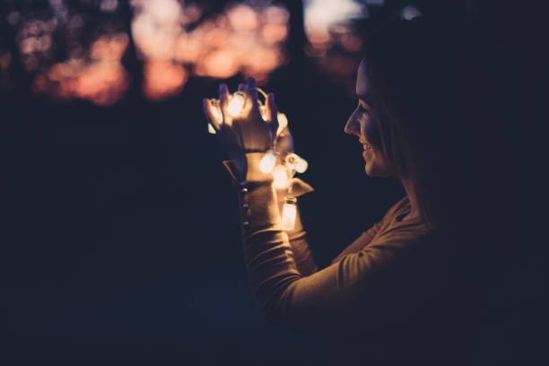 istock Girl in dusk with light 874538016