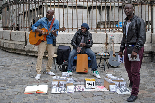 PARIS, FRANCE, June 21: Street Music Ensemble performs his own songs in front of the Sacre Coeur in Montmartre, June 21, 2012 in Paris. Series of other life in Paris.