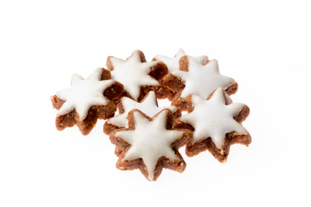 Heap cinnamon stars on white background