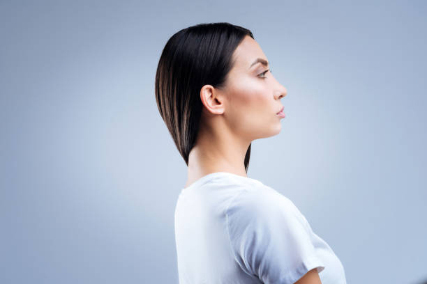 istock Serious strict doctor looking thoughtful while waiting for her patients 874544444