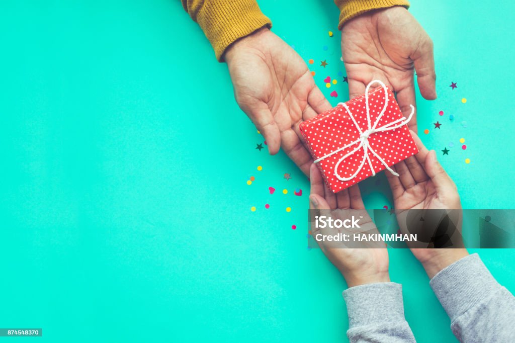 Male gives a gift to female with copy space Male gives a gift to female with copy space background.happiness moment concepts ideas Gift Stock Photo