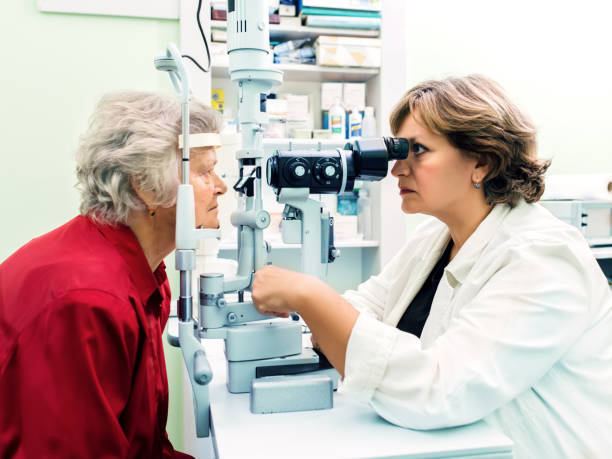 istock Senior woman visiting optician. 874554844