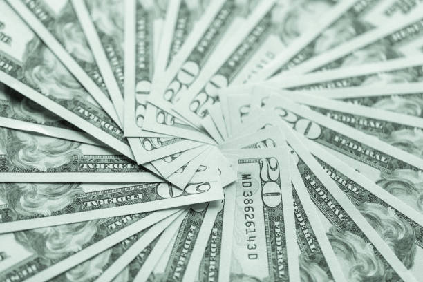 istock A group of American twenty dollar bills, used as a background. 874554848
