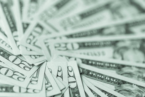istock A group of American twenty dollar bills, used as a background. 874555002