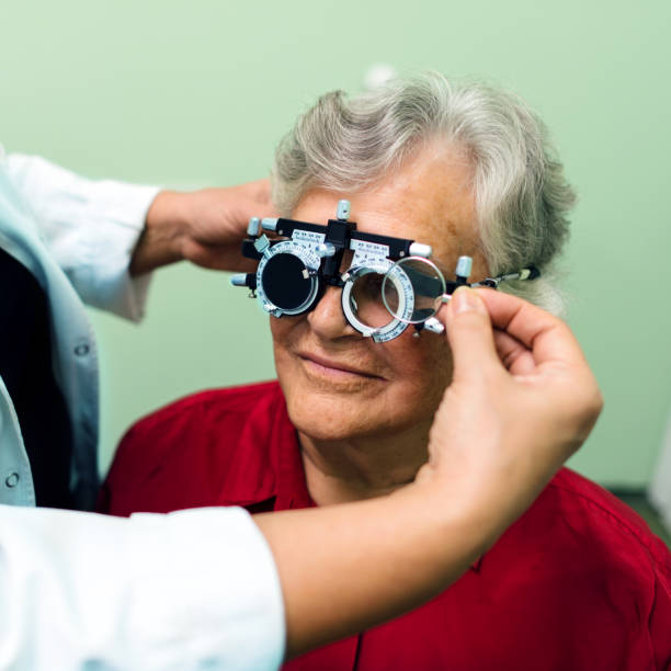 istock Senior woman having her eyes checked at ophthalmologist 874556564