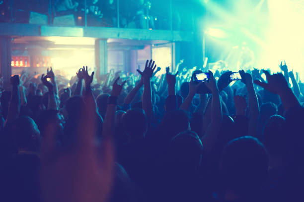 istock The audience watching the concert on stage. 874565958