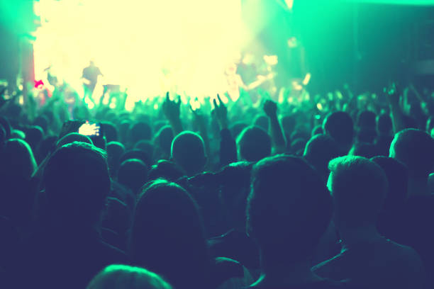 istock The audience watching the concert on stage. 874566420