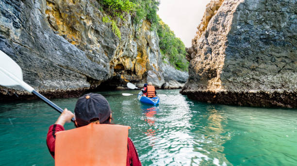 istock Group of tourists on a kayak 874569712