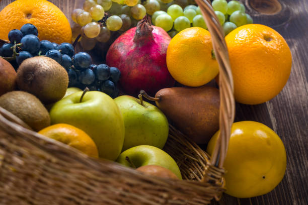 istock Composition with assorted fruits in wicker basket, healthy life 874569950