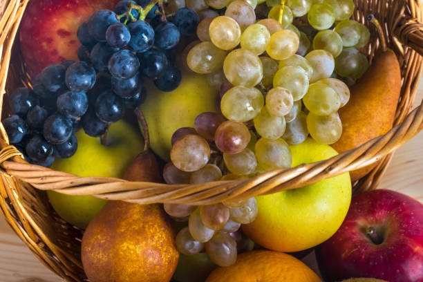 istock Composition with assorted fruits in wicker basket, healthy life 874570196