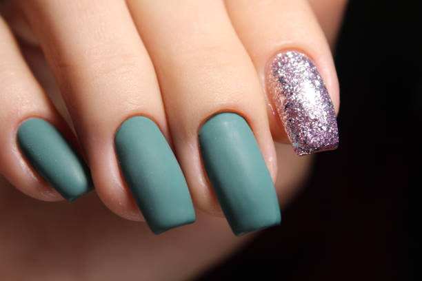 istock Green manicure with black and mirror detail 874572606