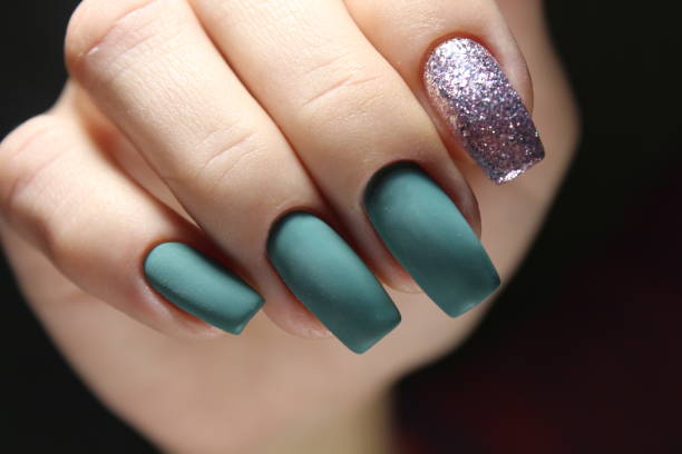 istock Green manicure with black and mirror detail 874573048