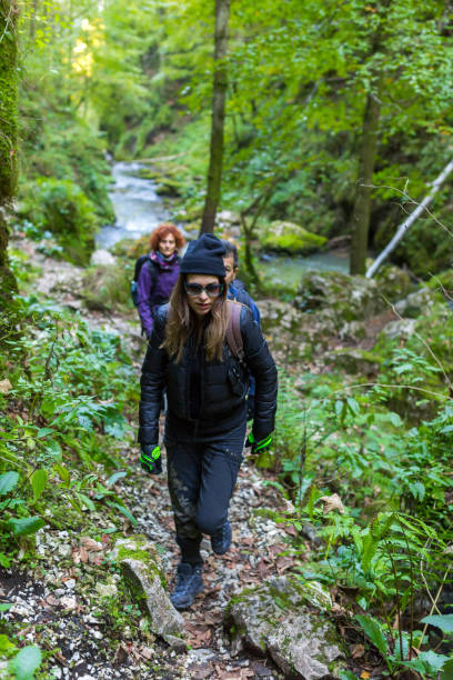 istock Tourists hiking on a trail 874573388