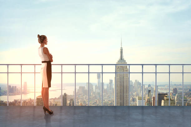 istock Businesswoman on rooftop 874578046