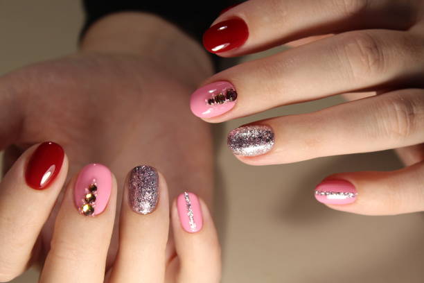 istock Manicured nails with pink nail polish. 874579192