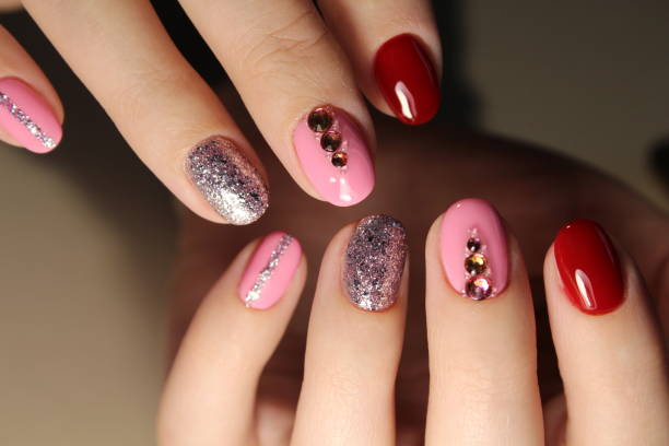 istock Manicured nails with pink nail polish. 874580158