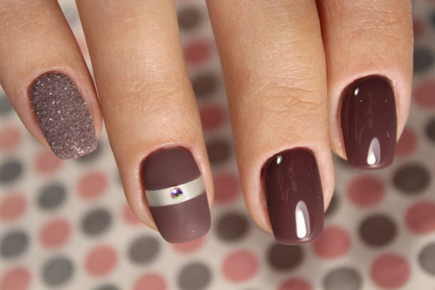 istock Nails black and coffee color with abstraction 874583556