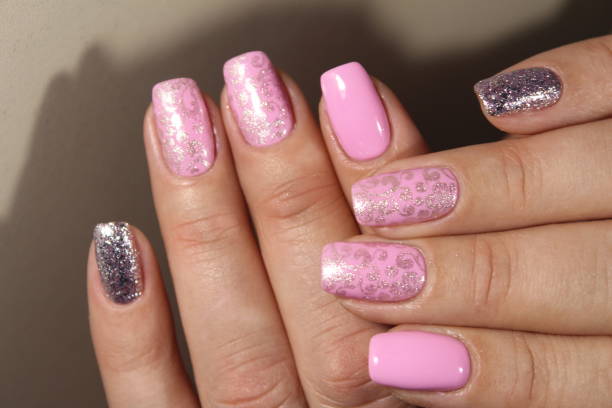 istock Manicured nails with pink nail polish. 874583648