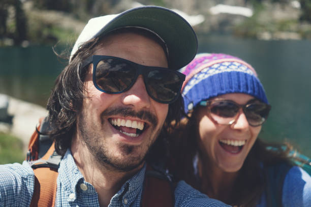 istock Self portrait of two young backpackers 874584052