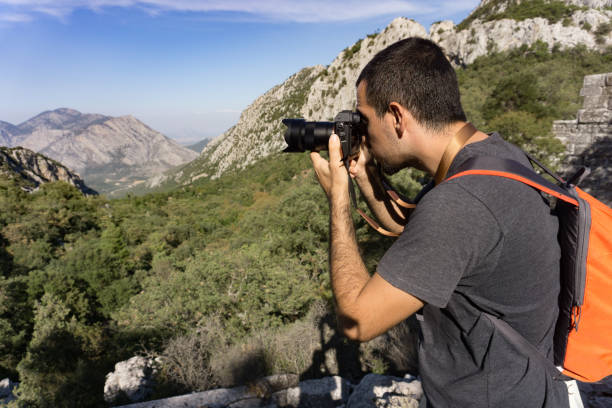 istock Male hiker photographing scene 874587604