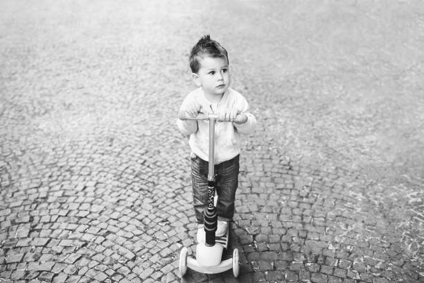 istock Cute liitle boy playing outdoor 874592838