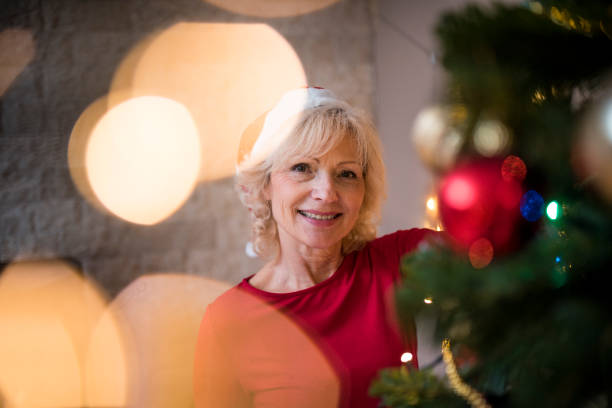 istock Senior couple celebrating Christmas at home 874593242