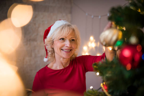 istock Senior couple celebrating Christmas at home 874593250