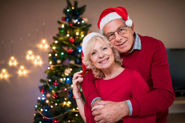 istock Senior couple celebrating Christmas at home 874593302