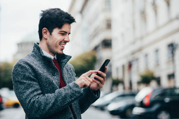 istock Man texting in the city 874597128