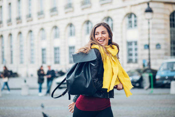 istock Cheerful woman in the city 874602800