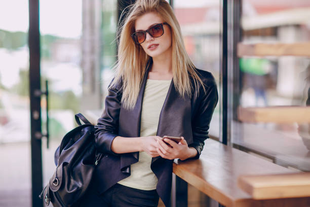 istock beautiful blonde on the street 874603616