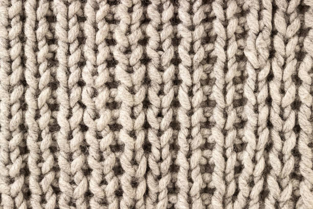 Knitted background. Knitting Pattern. Knitted texture. A sample of knitting.