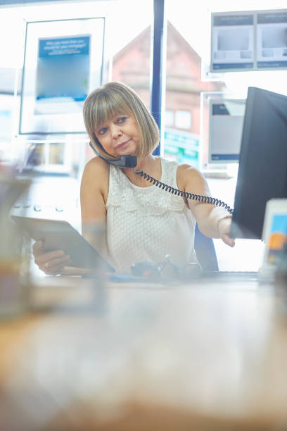 istock Office worker on the phone 874619812