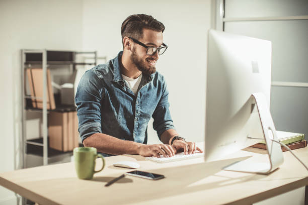 istock Young businessman in office 874632296