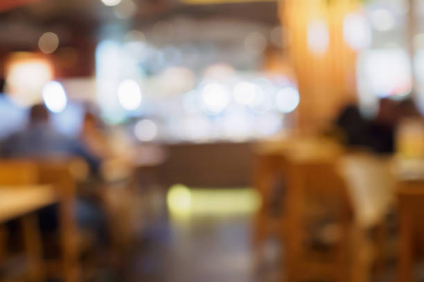 istock Blur customers in cafe restaurant or coffee shop abstract background with bokeh light 874633336