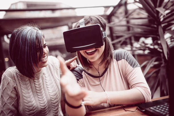 istock Young Woman Having Fun with Virtual Reality Simulator and Gesturing 874636016