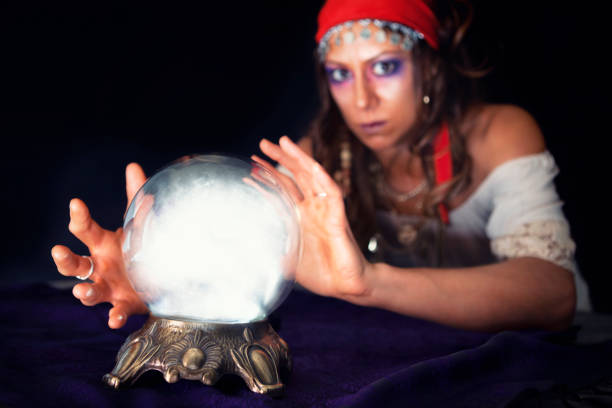 istock Gypsy looking into a Crystal Ball 874637380