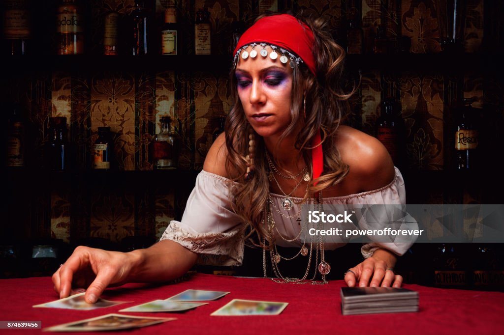 Gypsy Reading Tarot Cards Young woman Gypsy reading tarot cards. Tarot Cards Stock Photo