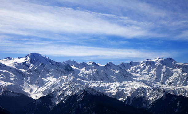 istock Sunlight snow mountain in wind winter evening 874641390