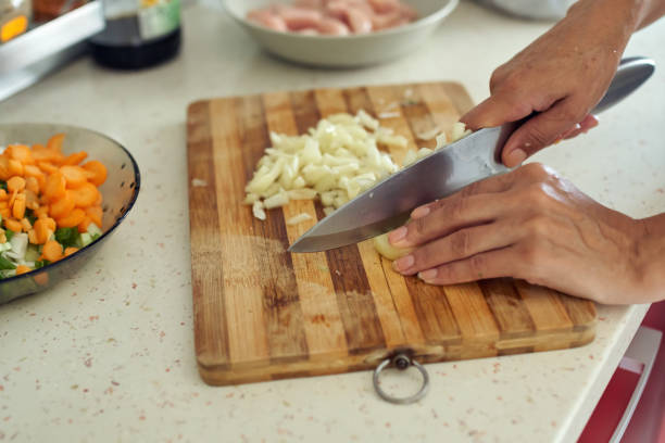 istock Woman chopping vegetables 874641454