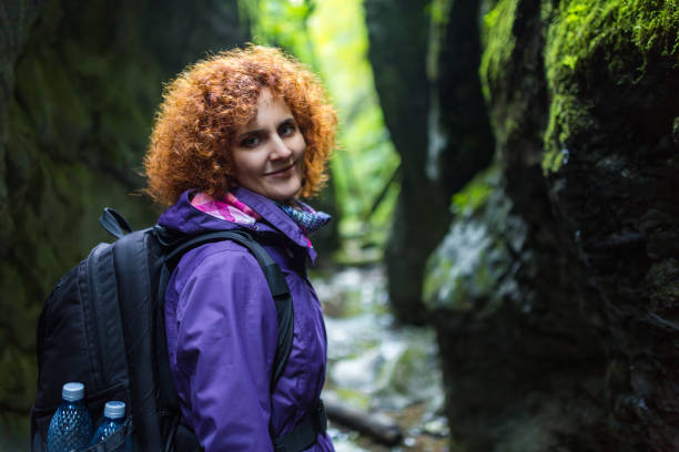 istock Hiker woman on a trail by the river 874641556