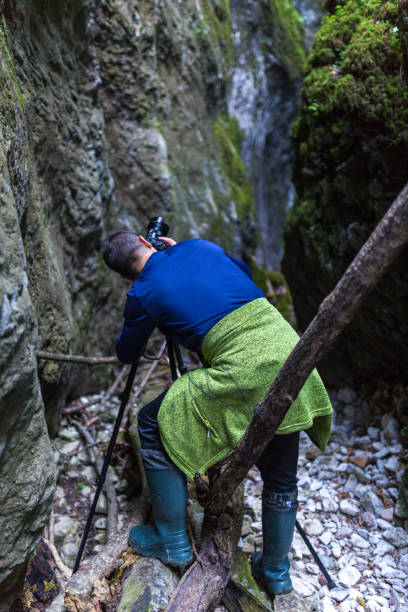 istock Photographer shooting landscapes in a canyon 874641578