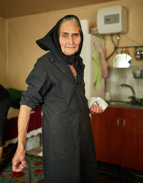 istock Happy old woman indoors 874641726