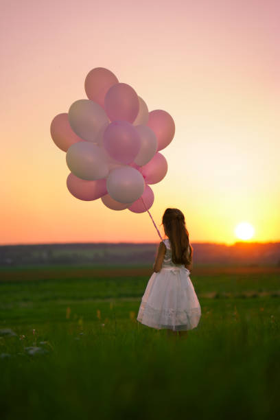 istock Girl at sunset 874642140