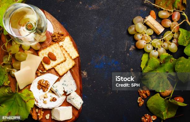 White Dry Wine Cheese With Mold Nuts Grape And Cracker Stock Photo - Download Image Now
