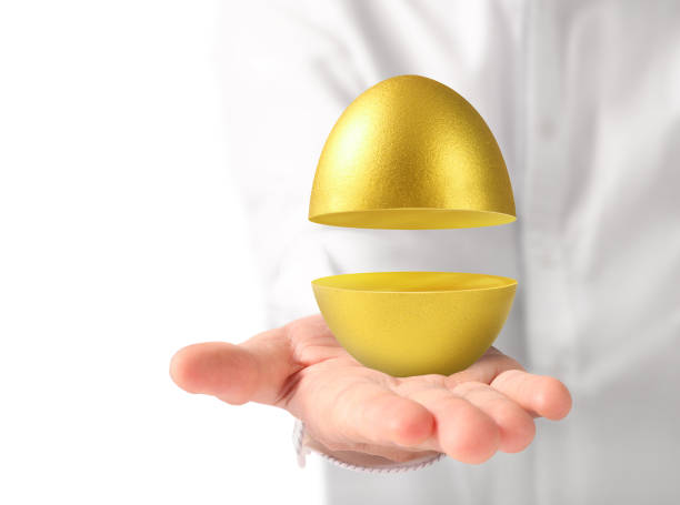 istock Hand Holding of golden eggs 874659402