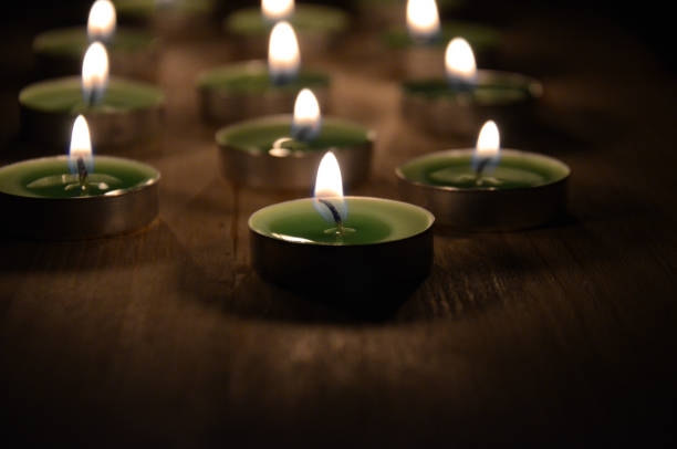 istock Candles on wooden background background is blurred 874662284