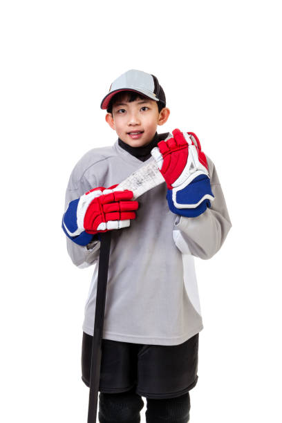 istock Junior Ice Hockey Player Isolated on White Background 874673614