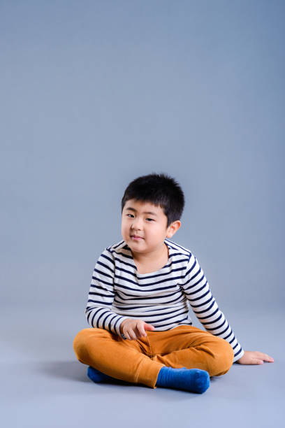 istock japanese child in studio portrait 874676028
